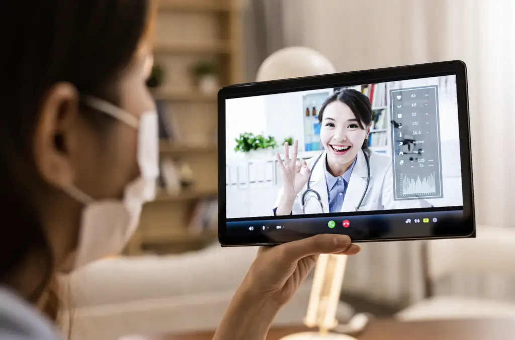 Doctor connects with patient via telehealth visit