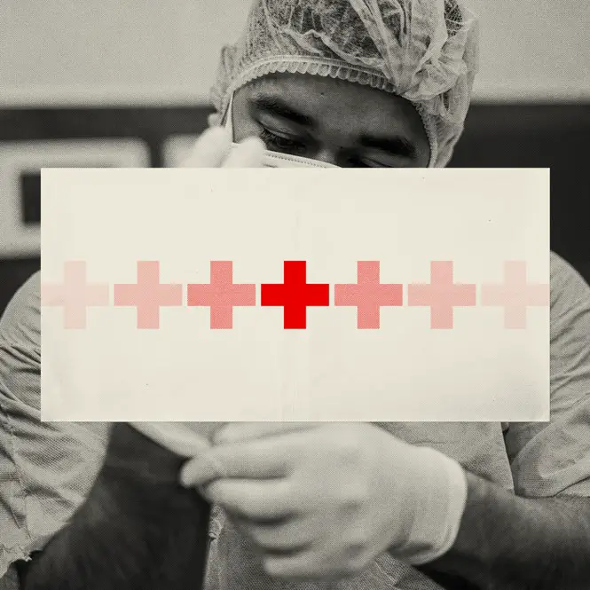 A masked health care worker in black & white with his face blocked by a white rectangle with a line of fading red crosses going across its middle