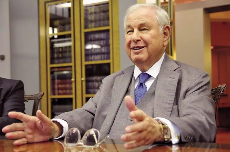 A. Alfred Taubman smiles while giving an interview to Crain's