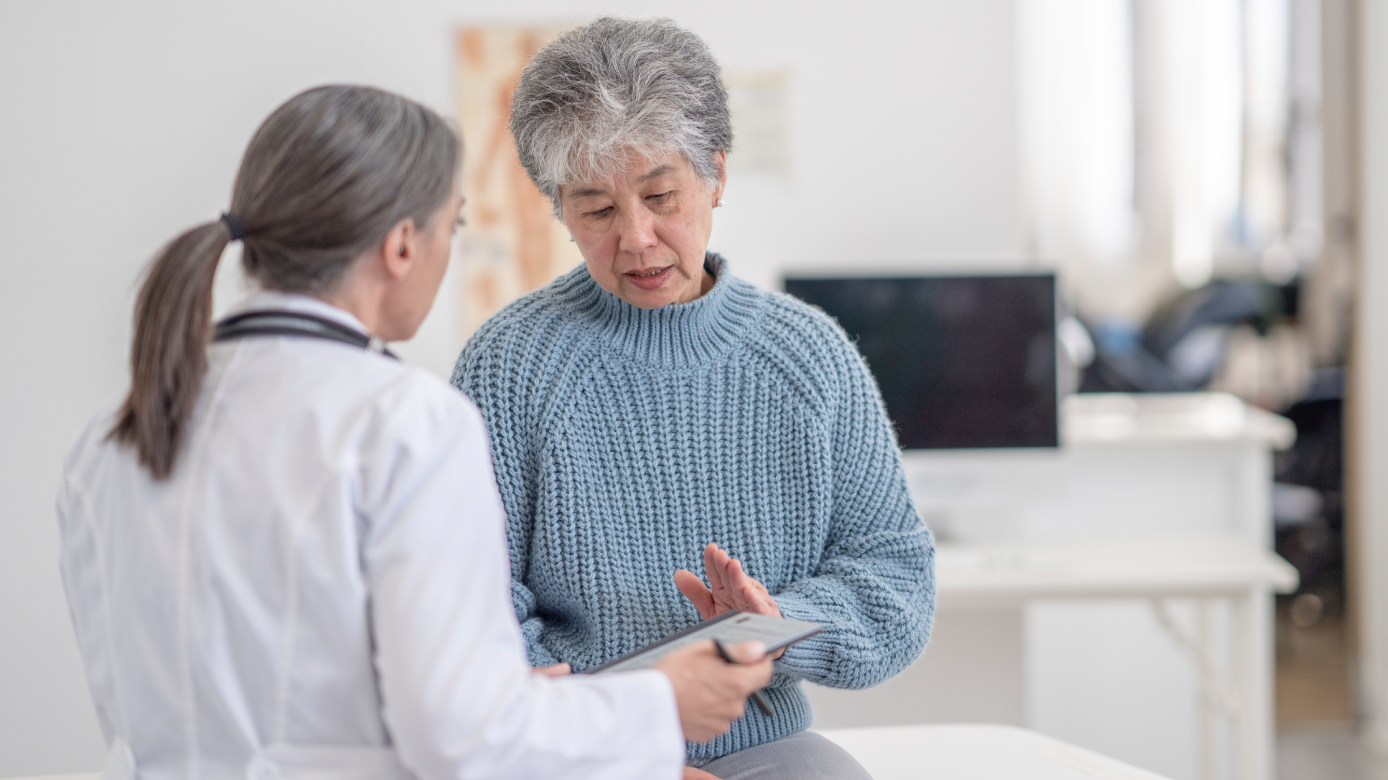 Older female patient talking with a doctor