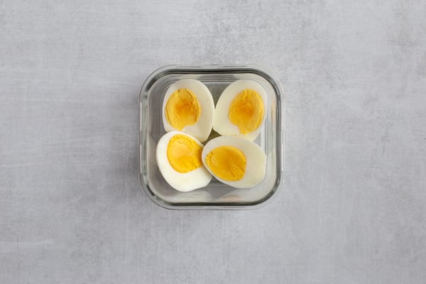 halved boiled eggs overhead | what is protein
