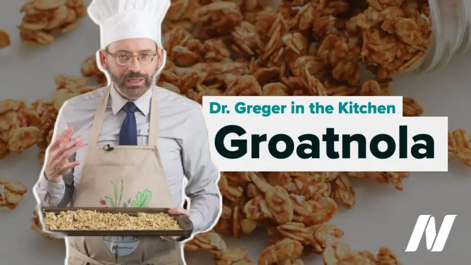 Dr. Greger holding cooking tray with groatnola