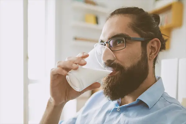 man drinking milk | Coconut Milk Benefits
