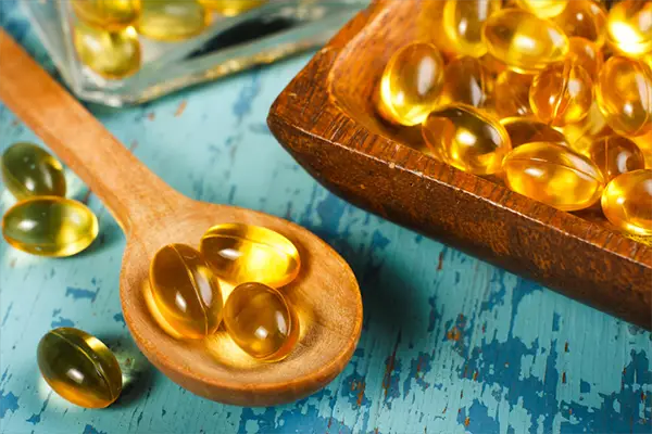 wooden spoon of cod liver oil | Foods High in Vitamin D
