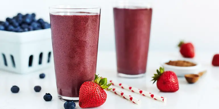Chocolate-dipped strawberries are the decadent inspiration for this Strawberry Thunder Shakeology smoothie recipe made with strawberries, blueberries, and chocolate.