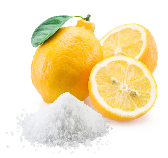 Pile of Citric Acid in Front of Cut and Whole Lemon | Citric Acid